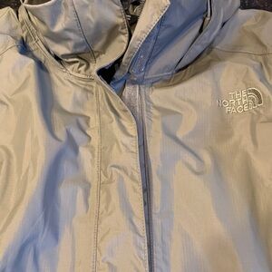 Womens gently used The North Face green hooded rain jacket